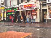 People waiting for the rain to stop